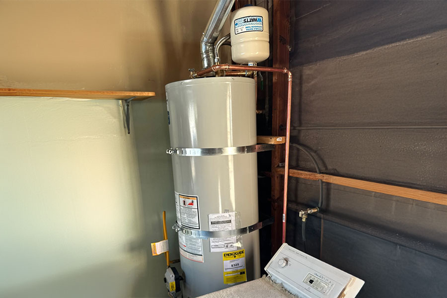 White water heater with metal straps
