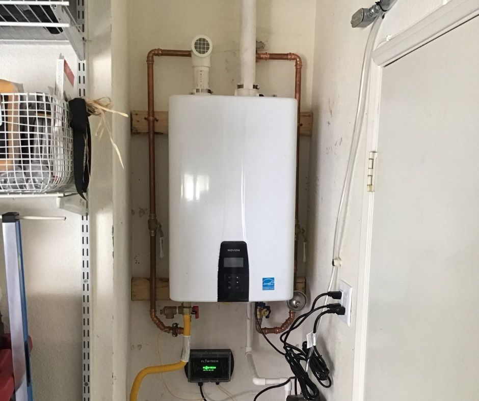 Navien tankless water heater installed in garage of Clairemont home by nearby plumber in San Diego