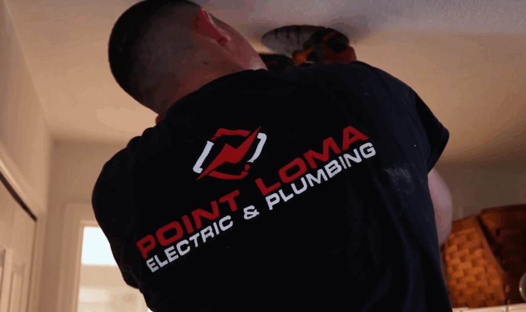 Electrician in Point Loma Home Pros shirt.