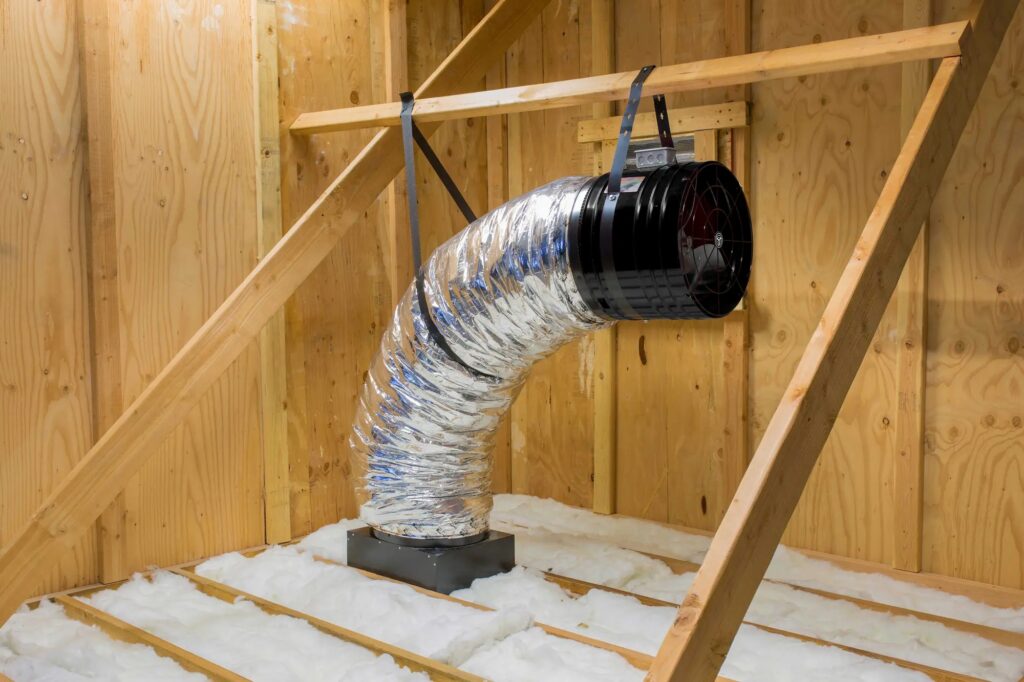 Quiet Cool whole house fan in the attic