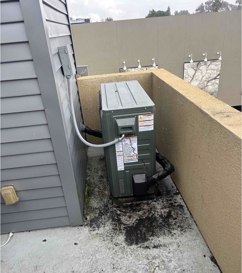 Rooftop AC unit showing moisture and debris buildup