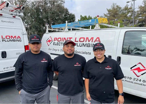 Three Point Loma Home Pros technicians in uniform standing in front of branded service vans.
