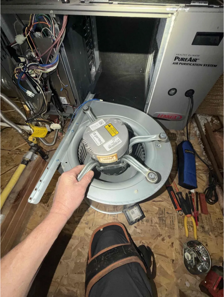 Licensed HVAC technician at work, the kind of hands-on expertise homeowners should look for when choosing an AC repair company