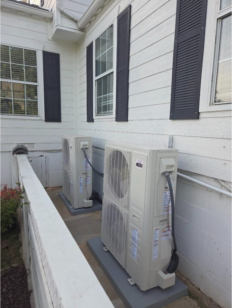 Multi-zone mini split system with separate outdoor condensers supporting each indoor zone.