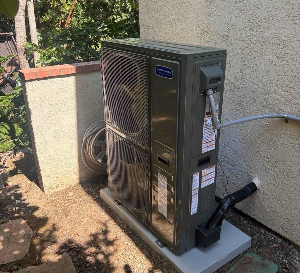 Outdoor air conditioning condenser where compressor and refrigerant repairs take place.