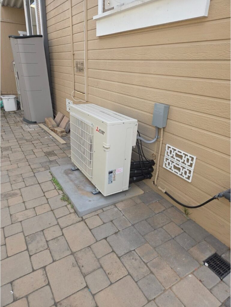 Outdoor mini split condenser installed at a residential home without ductwork