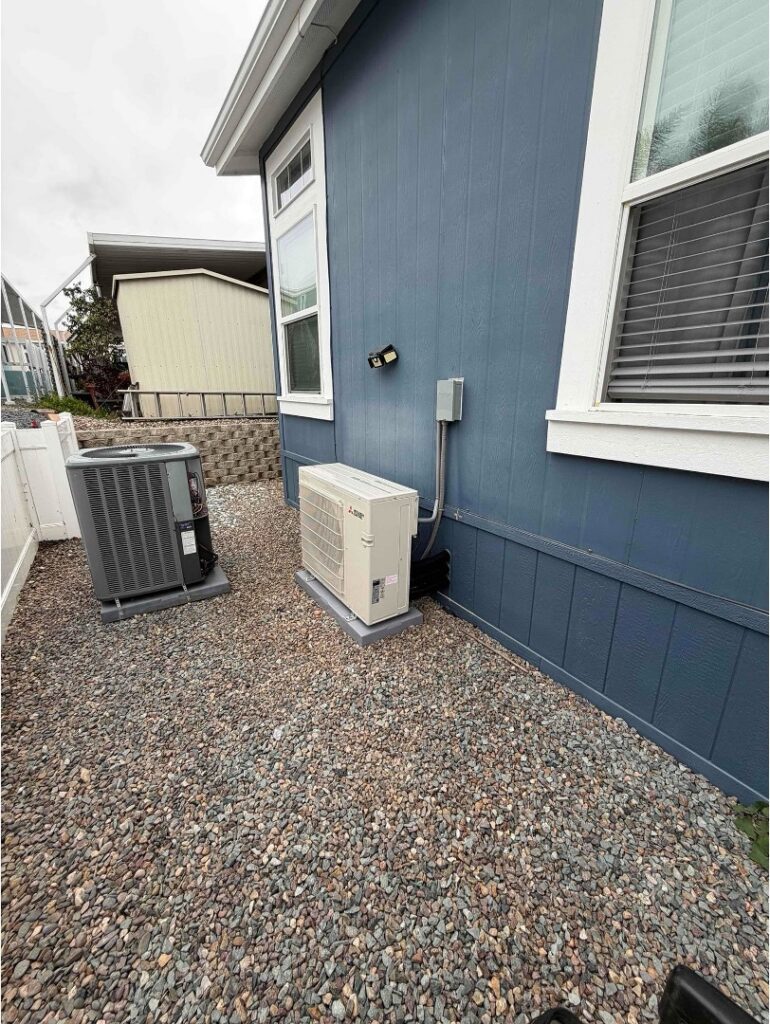 Outdoor mini split condenser installed with proper clearance for efficient airflow. 
