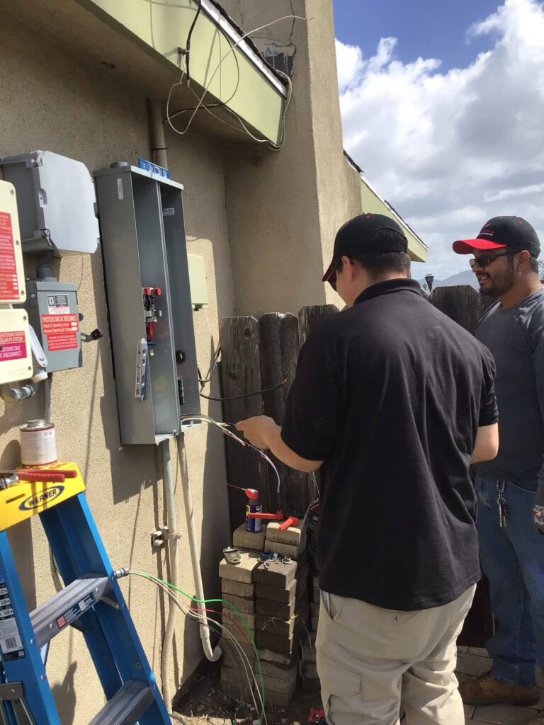Point Loma Home Pros’ technicians carrying out an electrical panel replacement in Oceanside.