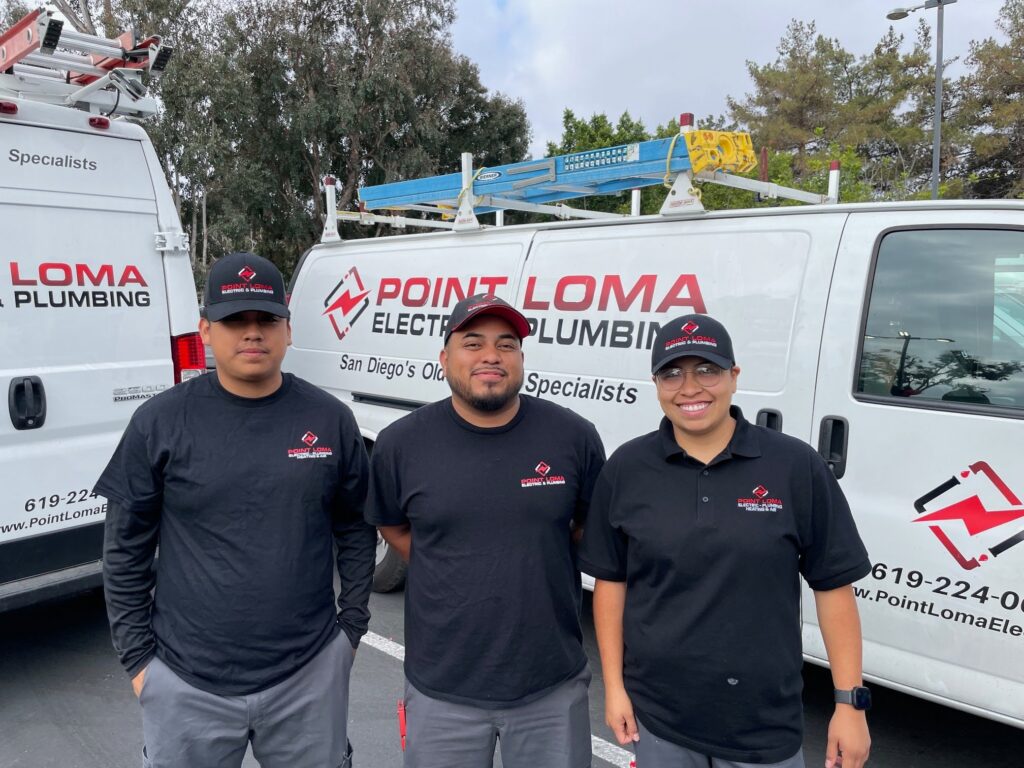 Three Point Loma Home Pros technicians in front of company service vans.