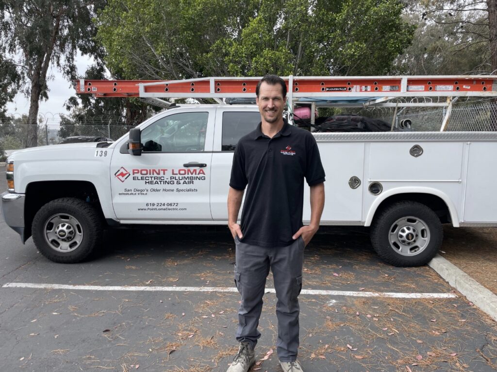 A Point Loma Home Pros technician standing in front of our branded service truck